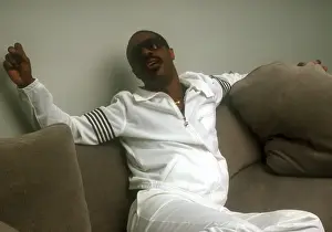 Prints of Musician Stevie Wonder poses for a portrait session on a couch wearing a white track suit at home in 1984. (Photo by Michael Ochs Archives/Getty Images) Visions of Wonder: Iconic Moments Captured: Stevie Wonder Portrait Session At Home