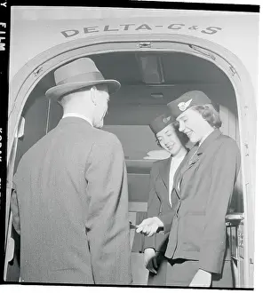 Stewardesses Checking Passenger Lists