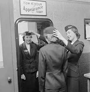 Adjusting Prints: Stewardesses Preparing for Flight