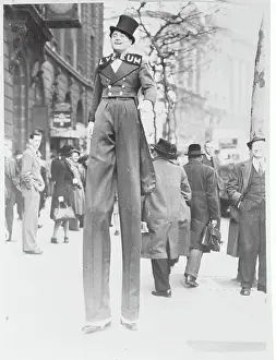 Stilt Walker Strolling with Pedestrians
