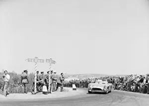 Prints of (Original Caption) 5/3/1955-Rome, Italy: His low-slung Mercedes racing car clinging to the road Vintage Car Collection Prints: Stirling Moss Racing Mercedes Racing Car