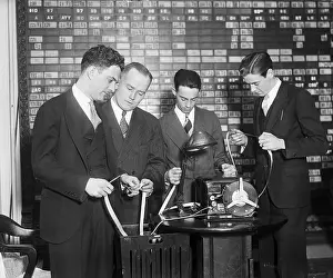 Economics Prints: Stock Brokers Read New Ticker Tape
