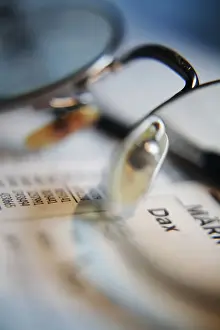 Eyeglasses Prints: Stock market news, headline Dax and markets in a newspaper seen through glasses