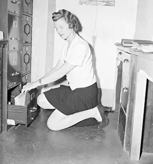Painted Prints: Store Clerk Kneels Wearing Legstick
