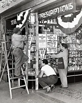 Storefront Prints: Store Owner Preparing Window for a Sale