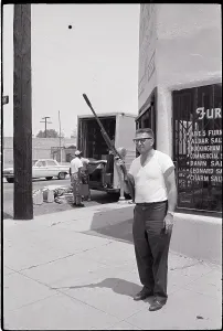 Owner Prints: Store Owner with Rifle