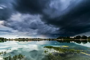 Images Dated 5th September 2016: Storm clouds over a quarry lake with water plants, near Mindelheim, Unterallgau, Allgau, Bavaria