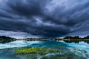 Images Dated 5th September 2016: Storm clouds over a quarry lake with water plants, near Mindelheim, Unterallgau, Allgau, Bavaria