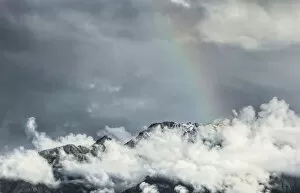 Images Dated 7th December 2011: Storm clouds with a rainbow, Southern Alps, Fox Glacier, South Island, New Zealand