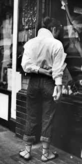 Window Prints: Street Fashion 1953; fashionable young woman window shopping in Londons Piccadilly