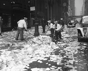 Sweeping Prints: Street Sweepers Cleaning After Parade