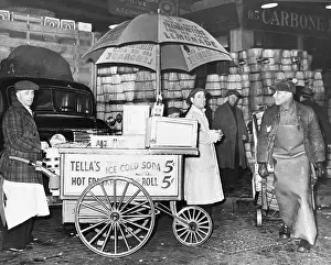 Prints of (Original Caption). New York City: Ice cream and frankfurter wagon near New York's Washington Market. Undated photograph A Journey Through Fashion History: Street vendor and customers. Washington Market, New York City, New York State, USA