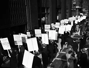 Picketing Prints: Strikers March in Lines Outside Building