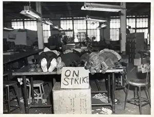 Workshop Prints: Striking Workers Lie On Table with Shoes Off