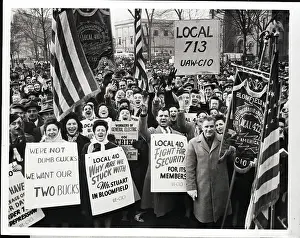 Striking Workers with Signs Stating Demands