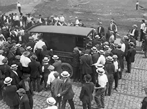 Surrounding Prints: Striking Workers Surround Ambulance