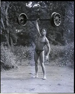 Strong Prints: Strong Man Lifts Railroad Axle W/Hand