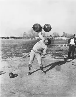 Powerful Prints: Strongman Lifting Dumbell