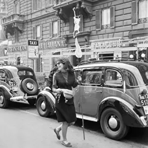 Student Collecting Money in Rome Traffic