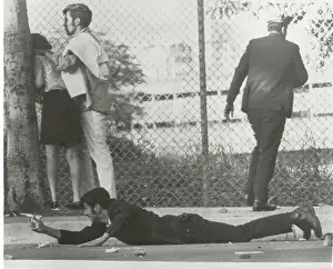 Student Taking Cover on the Ground