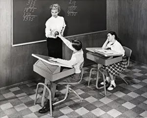 Students In Classroom With New Desks