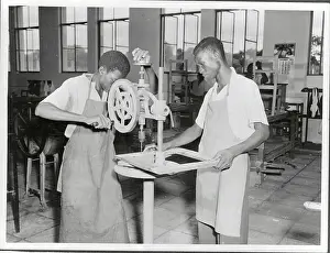 Leopoldville Prints: Students Learning How to Operate a Drill