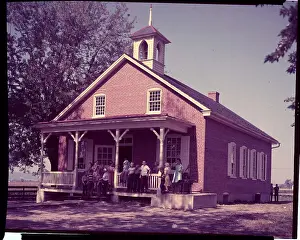 Students Standing on Porch of One Room Schoolhouse