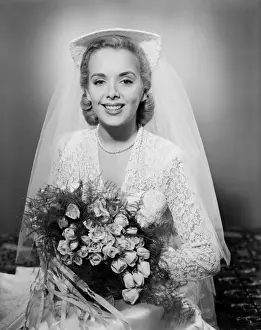 Hair Back Prints: Studio portrait of mid adult bride