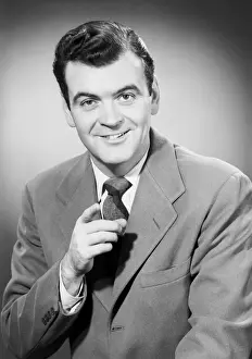 Index Finger Prints: Studio portrait of mid adult man pointing