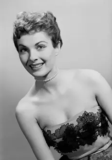 Studio portrait of mid adult woman