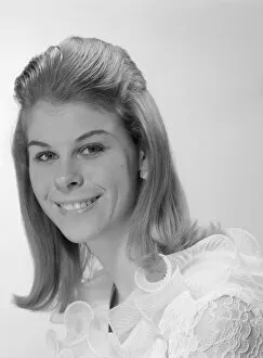 Images Dated 27th June 2008: Studio portrait of young woman smiling