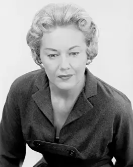 Studio shot of mature woman looking down