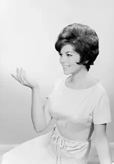 Grace Prints: Studio shot of young woman with arm raised