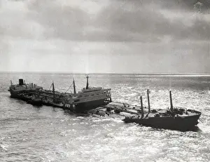 Sinking Prints: Almost Submerged Oil Tanker In Ocean