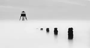 Prints of Harwich, Essex, UK. October 30, 2010. Image shows a serene view a 19th century lighthouse in Harwich. The long exposure shot at high tide give us a ghostly serene atmosphere Lighthouse Prints: The Subtle Art of Silence