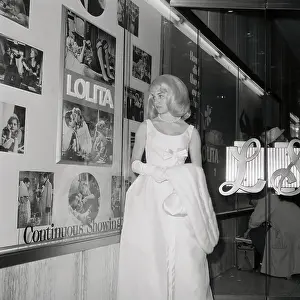 Sue Lyon Looking at a Billboard