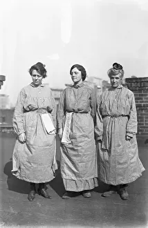 Prints of (Original Caption). Suffs who did their bit in prison for picketing White House pose in workhouse garb...Left to right, Miss Doris Stevens, Mrs. J.A Voices of Liberty: Suffragettes in Action: Suffragettes Modeling Their Prison Uniforms