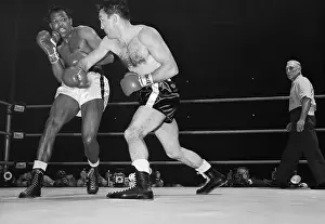 Sugar Ray Robinson Recoils from Carmen Basilio Punch