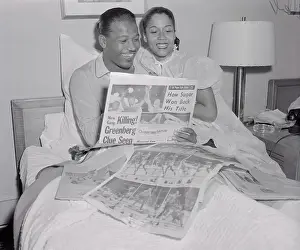 Sugar Ray Robinson and His Wife Reading the Newspaper