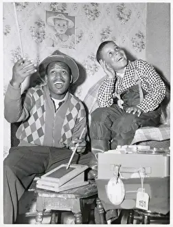 Sugar Ray Robinson with Young Son Enjoying Music