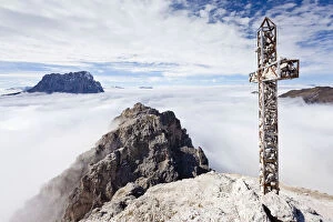 Summit cross on Gran Cir Mountain, using the climbing route above Gardena, overlooking Val Gardena