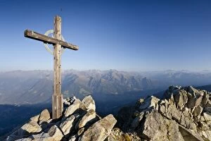 Pinnacle Collection: Summit cross on Ifinger Mountain above Merano with a view into the Passaiertal Valley