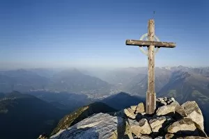 Images Dated 25th August 2011: Summit cross on Mt Ifinger or Ivigna in morning light, Meran or Merano below