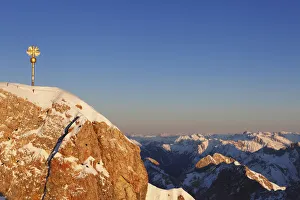 Pinnacle Collection: Summit cross on Zugspitze Mountain in the evening light, looking towards the east