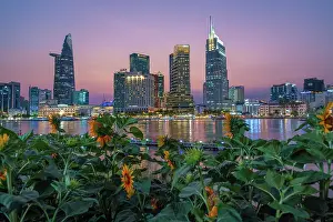 Urban Prints: Sunflower Garden at night with Ho Chi Minh City Skyline Reflections