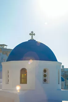Beam Gallery: Sunlight over blue domed church, Santorini, Greece