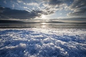 Images Dated 20th February 2012: Sunlight with moody clouds, stacked ice floes on the shore of Reichenau Island