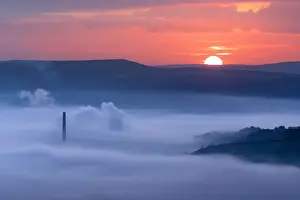 Mist Prints: Sunrise over a foggy Castleton, English Peak District. UK