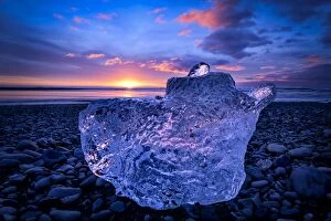Images Dated 4th March 2016: Sunrise over ice at black beach of JAokulsAarlAon glacier lagoon