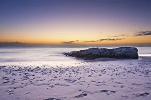 Images Dated 10th December 2014: Sunrise landscape of ocean with waves clouds and rocks on beach